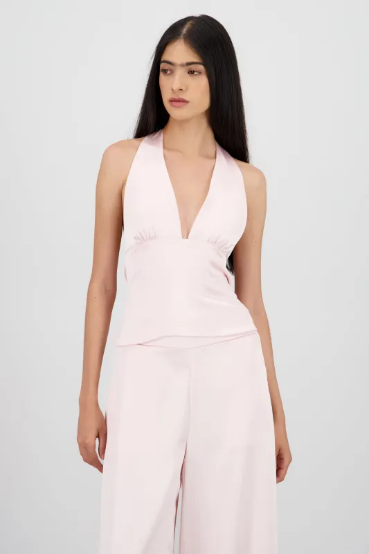 Top satinado escote espalda sold by Shasa