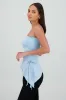 Top con jareta strapless liso sold by Shasa