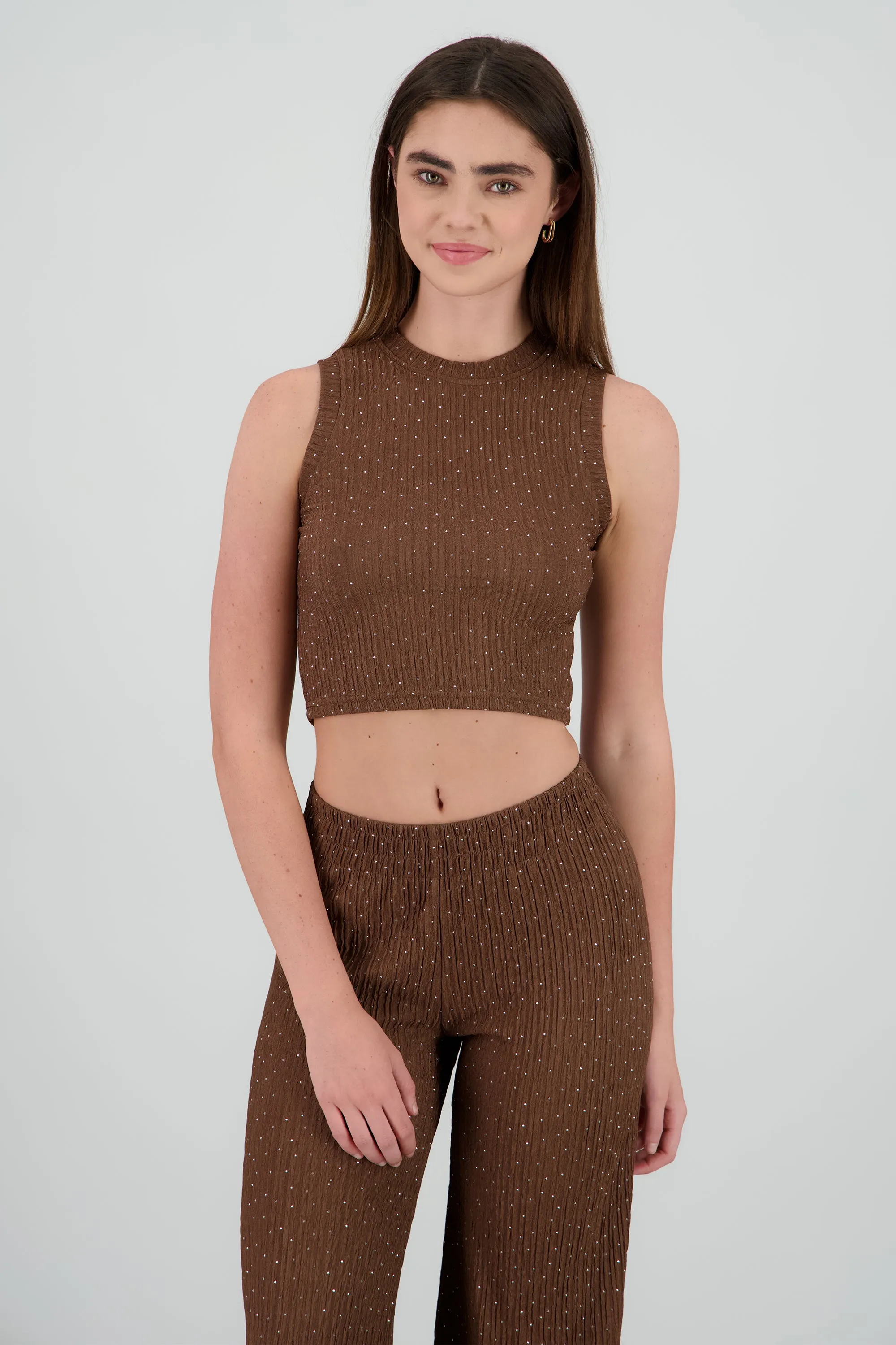 Top sin mangas textura brillos sold by Shasa