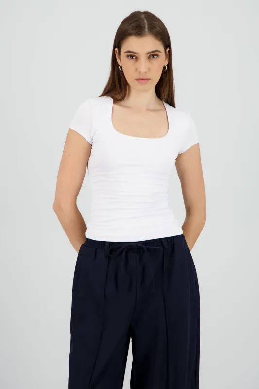 Top largo escote audrado sold by Shasa