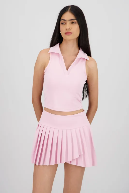 Top polo sin manga liso sold by Shasa