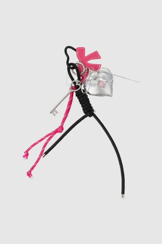 Charm corazon chubby moño sold by Shasa