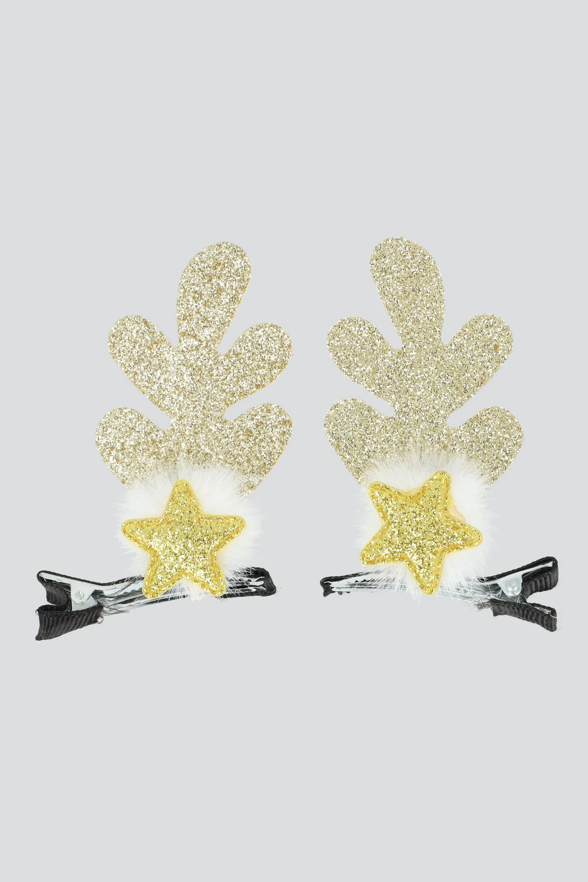 Broches cuernos estrellas sold by Shasa
