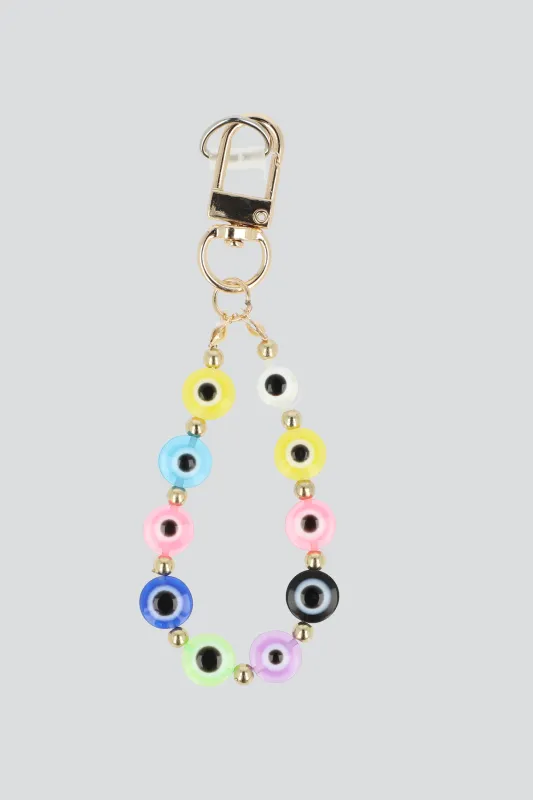 Cel charm correa ojitos sold by Shasa