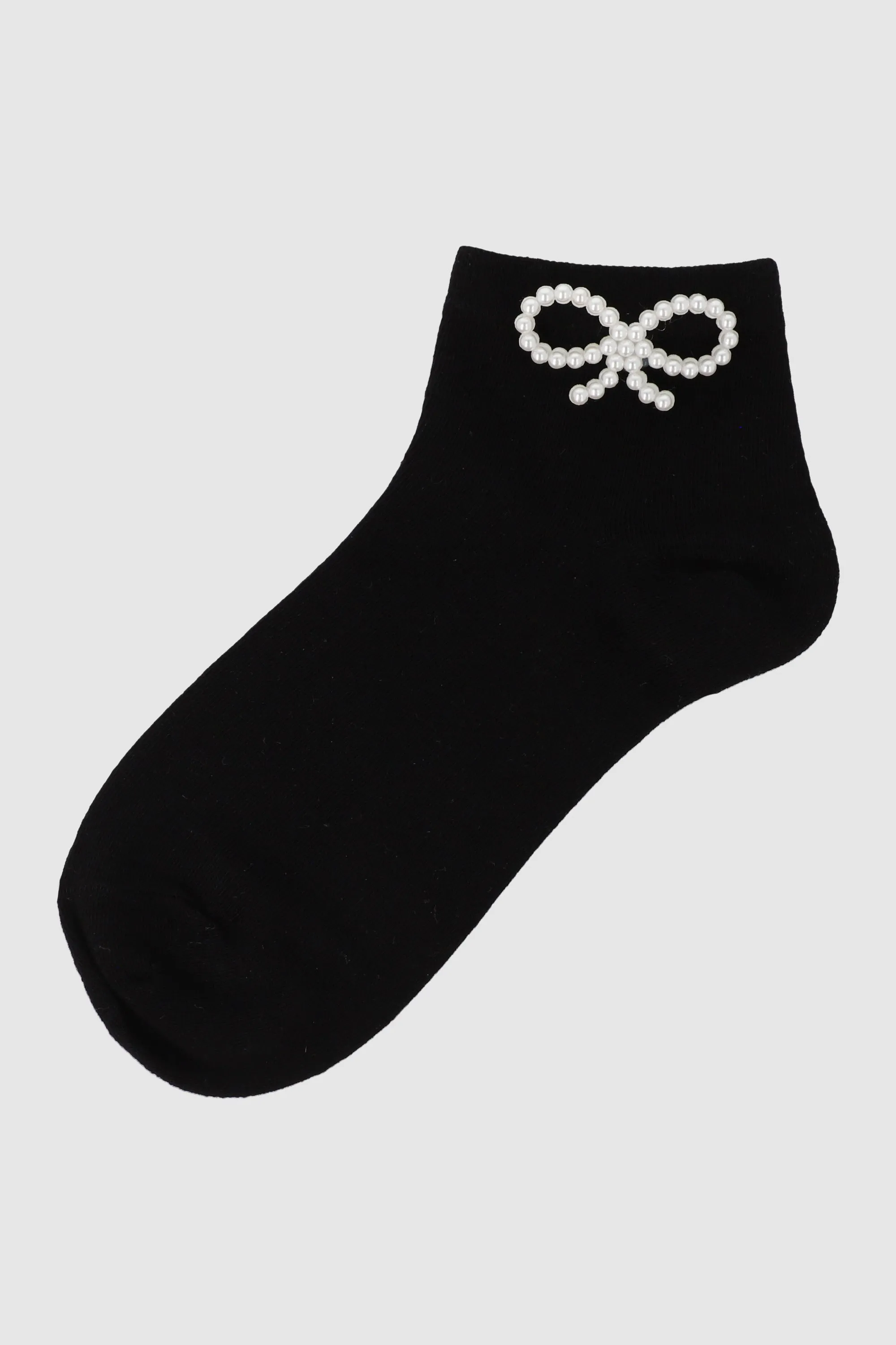 Tin moño perlitas sold by Shasa