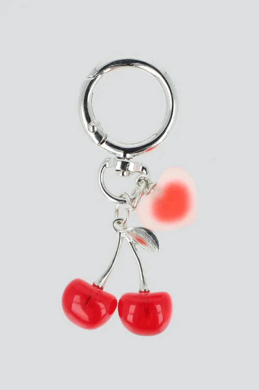 Charm cel corazon cerezas sold by Shasa