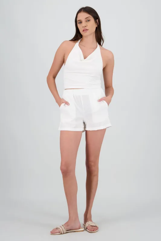 Short de lino con bolsas sold by Shasa