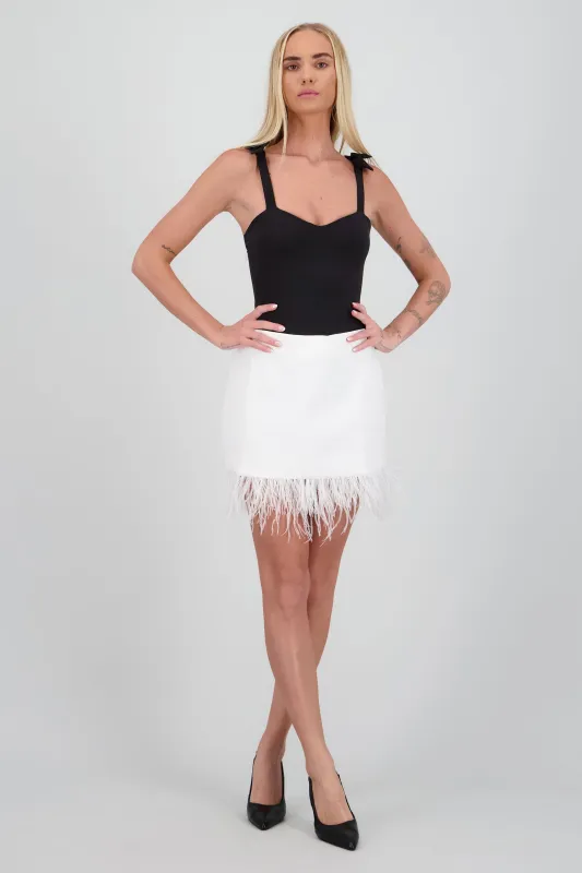 Falda detalle plumas sold by Shasa