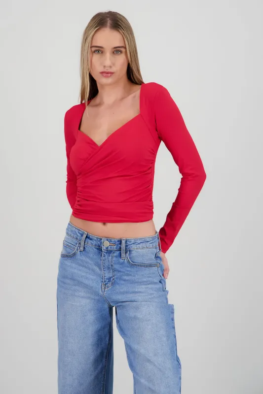 Top manga larga detalle fruncido en costados sold by Shasa