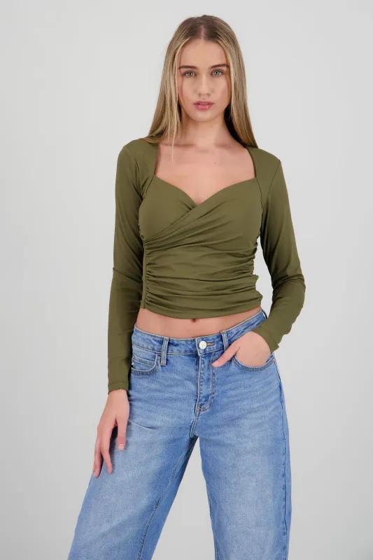 Top manga larga detalle fruncido en costados sold by Shasa