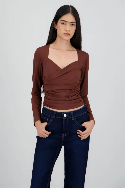 Top manga larga detalle fruncido en costados sold by Shasa