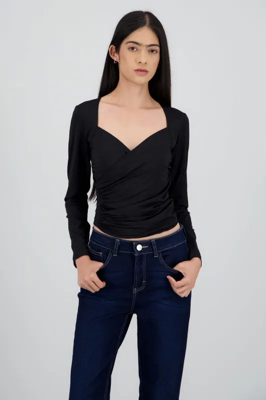 Top manga larga detalle fruncido en costados sold by Shasa