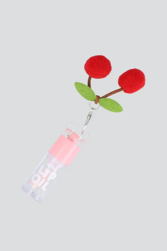 Lip oil charm cerezas pompon sold by Shasa