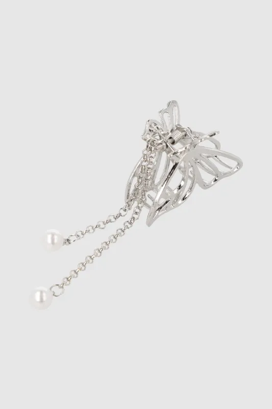 PINZA MARIPOSA METAL COLGUIJE sold by Shasa