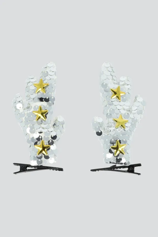 Set 2 broches cuernos lentejuela sold by Shasa