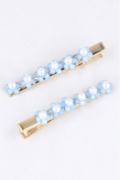 Set 2 piezas pasador flores sold by Shasa