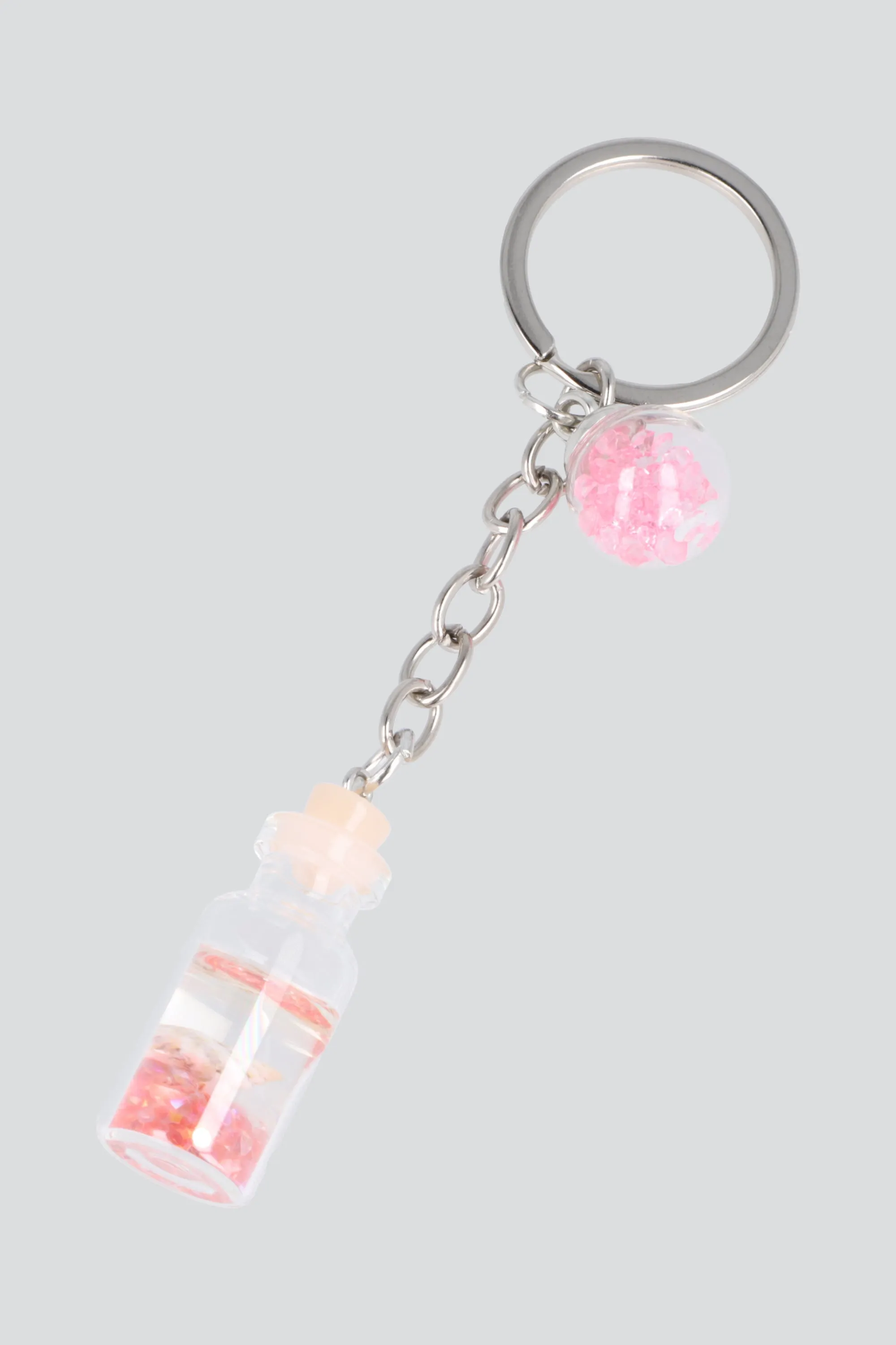 Llavero frasco esfera sold by Shasa