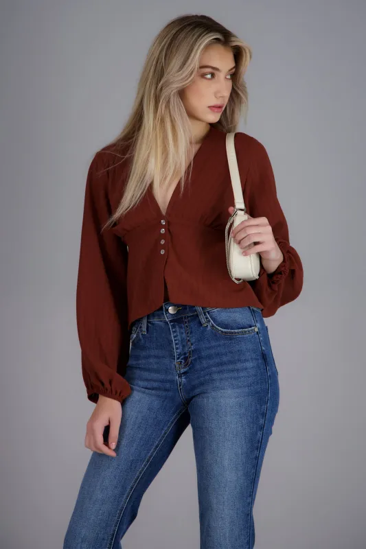 Blusa manga larga abullonada detalle botones sold by Shasa