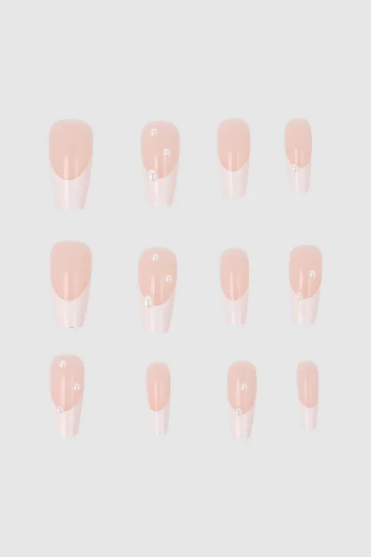 Set 12 uñas french perlas sold by Shasa