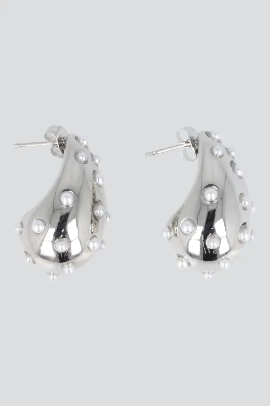 Aretes gota incrustaciones sold by Shasa