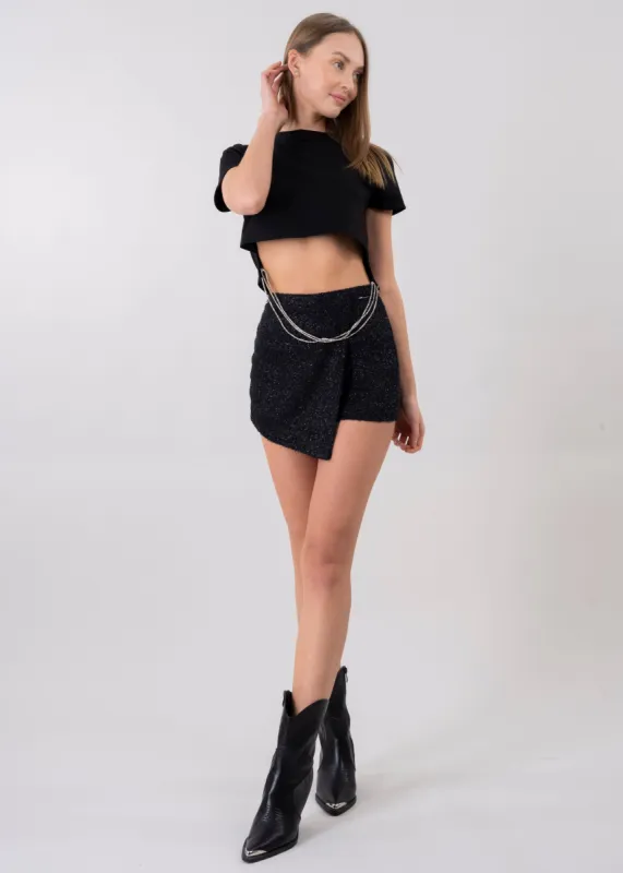 Falda short brillos peluche sold by Shasa