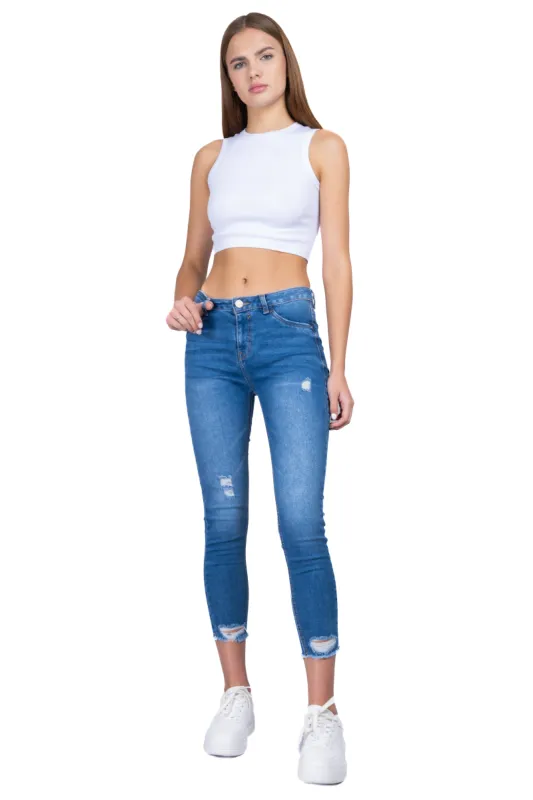 Jeans skinny con destrucción sold by Shasa