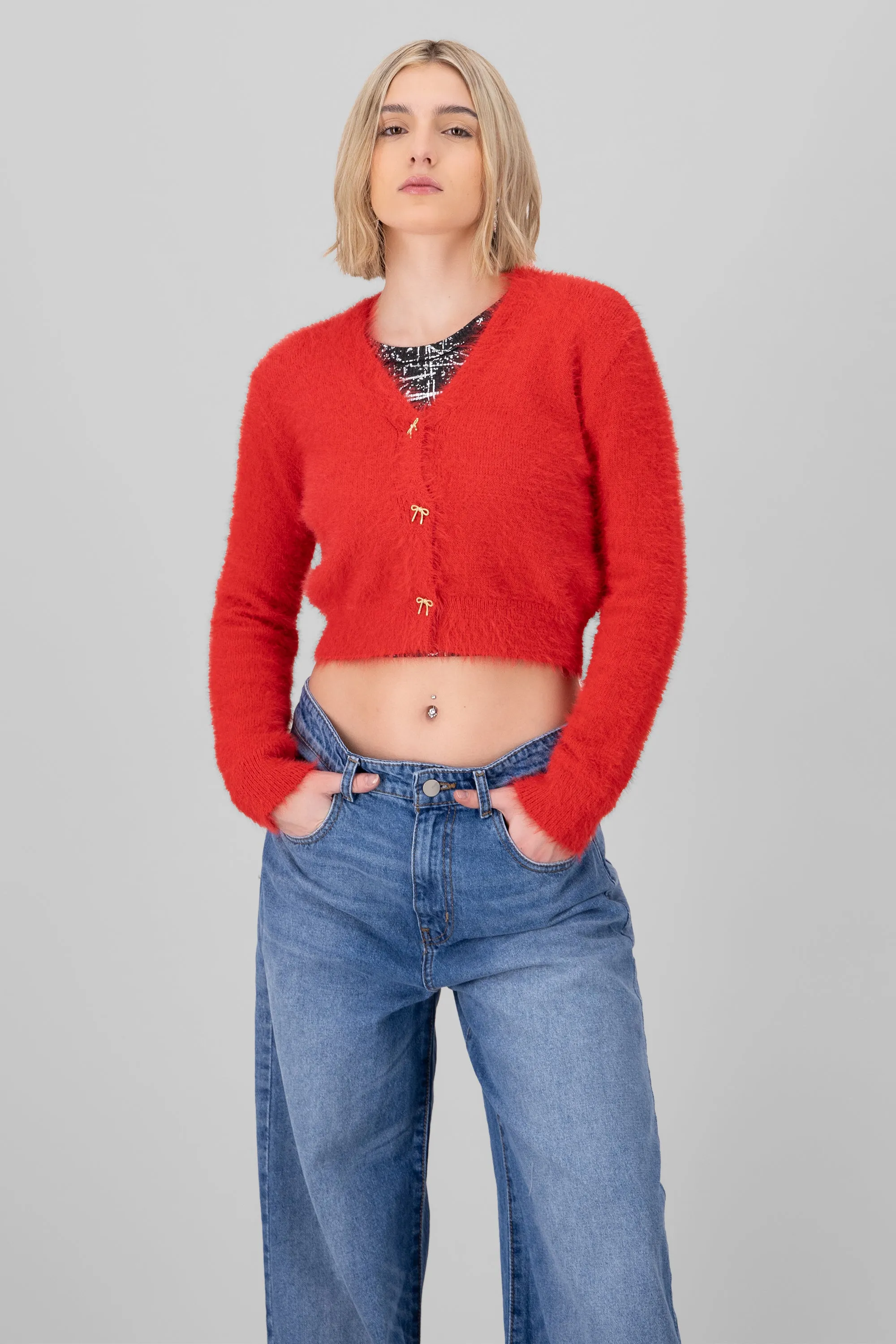 Cardigan detalle botones moños sold by Shasa