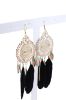 Aretes atrapasueños plumas sold by Shasa