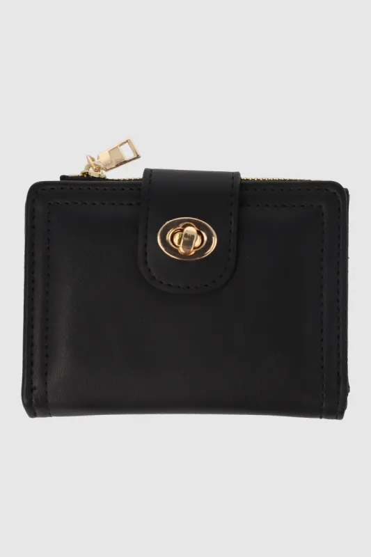 Cartera pequeña broche giratorio sold by Shasa