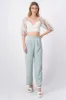 Pantalón pinzas plisadas satín sold by Shasa