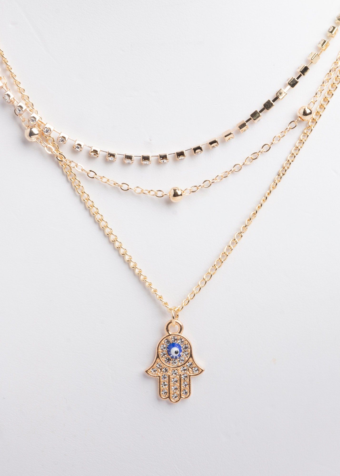 Collar capas mano hamsa sold by Shasa