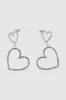 Aretes colgantes de corazones con brillos sold by Shasa