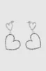 Aretes colgantes de corazones con brillos sold by Shasa