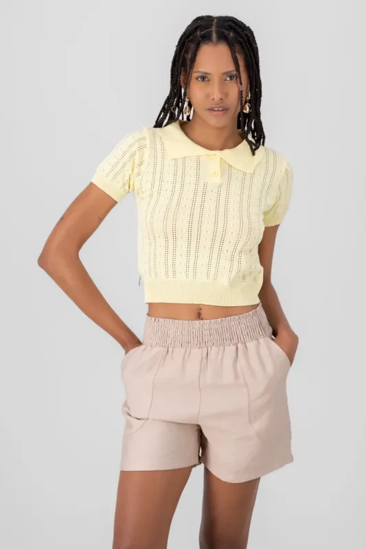 Top tejido cuello polo manga corta sold by Shasa