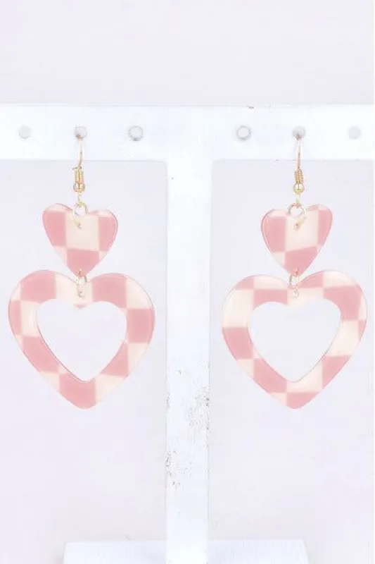 Aretes corazón cuadros sold by Shasa