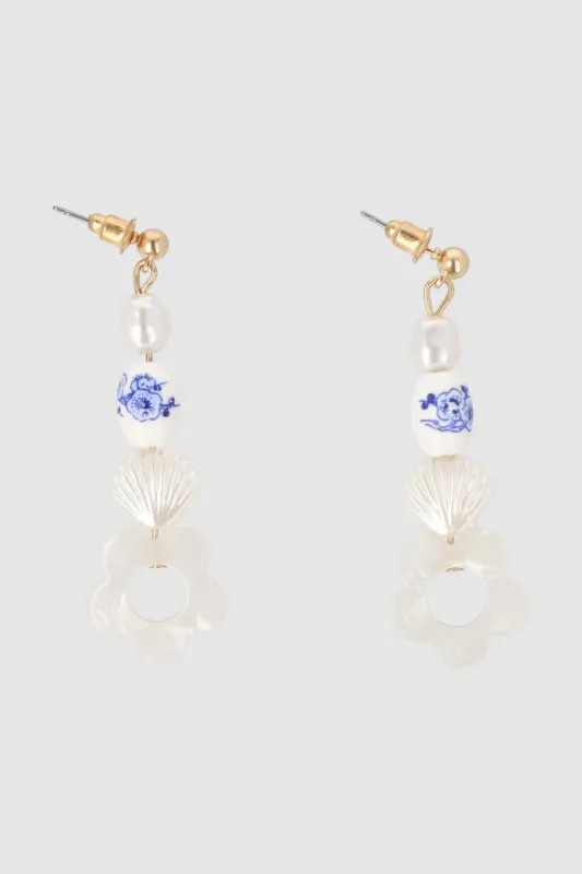 Aretes Flor Piedra Perla sold by Shasa