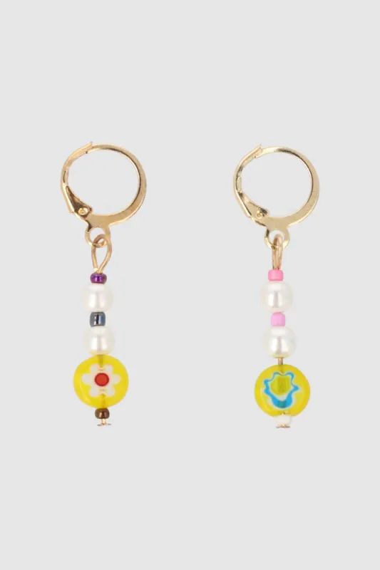 Arracadas Perlas Flor Encapsulada sold by Shasa