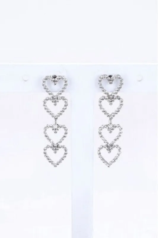Aretes largos corazón brillos sold by Shasa