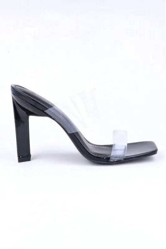 Tacón pirámide mula tiras transparentes sold by Shasa