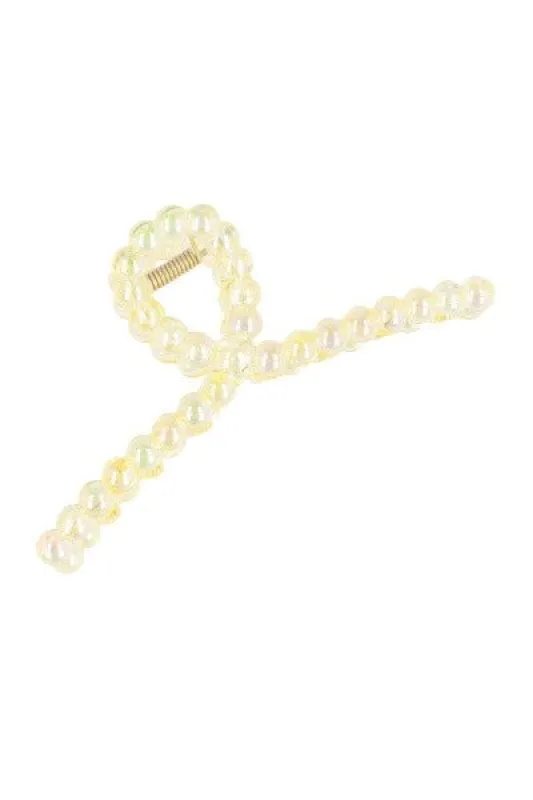 Pinza larga nudo círculos sold by Shasa