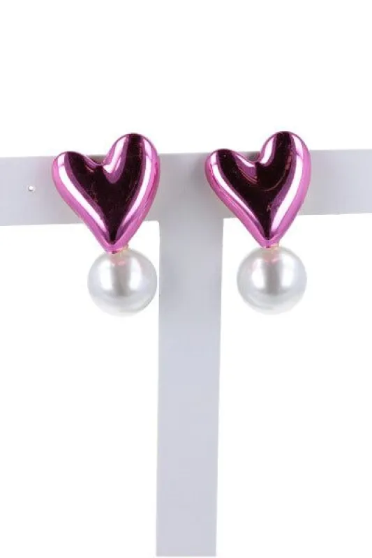 Aretes corazón perla sold by Shasa
