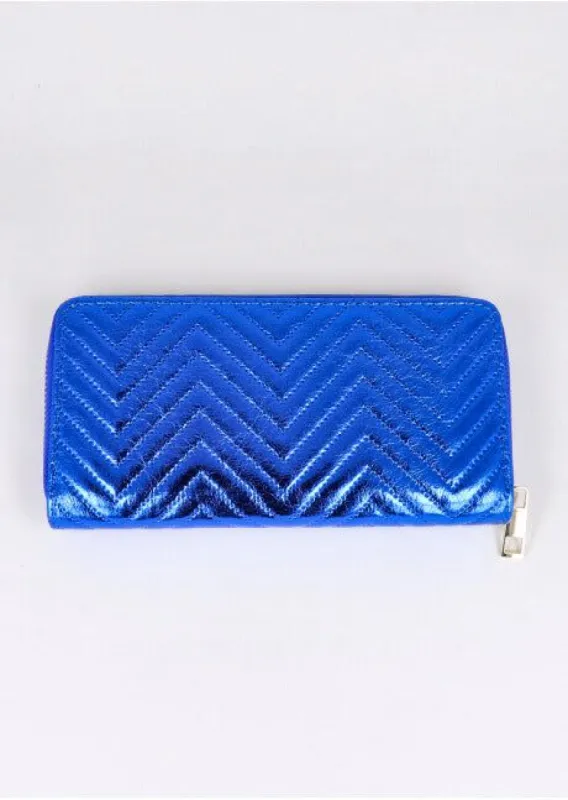 Cartera grecas metalizada sold by Shasa