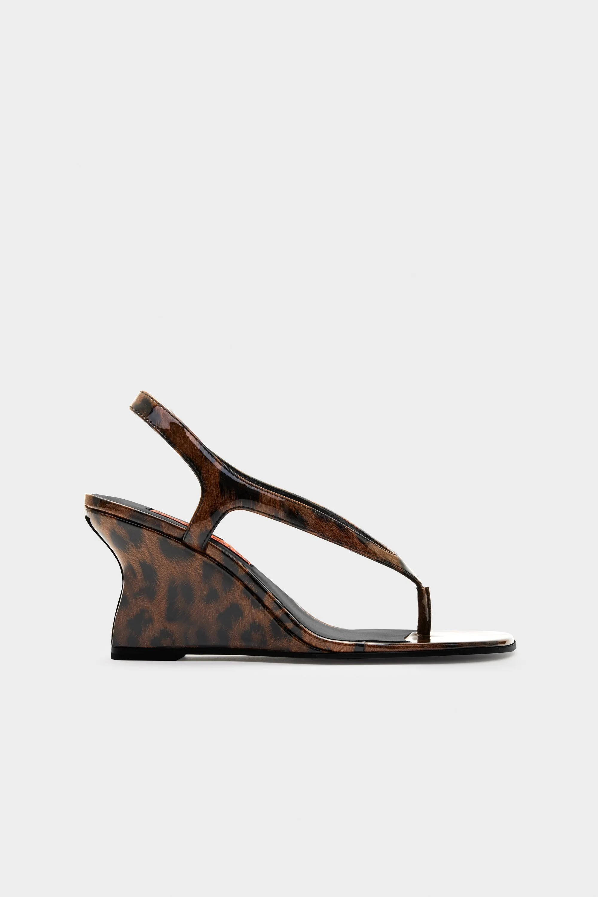 Beep Thong Wedge In Cheetah sold by Simon Miller
