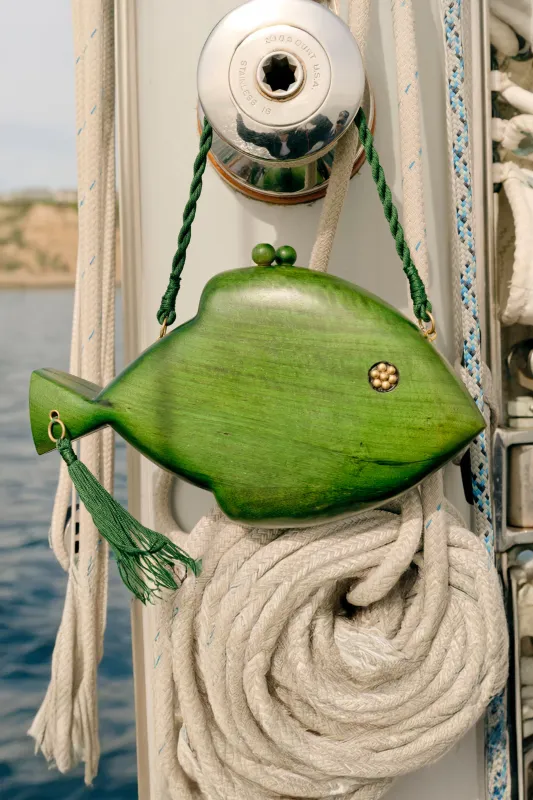 Carved Wooden Fish Clutch in Gummy Green made by Simon Miller