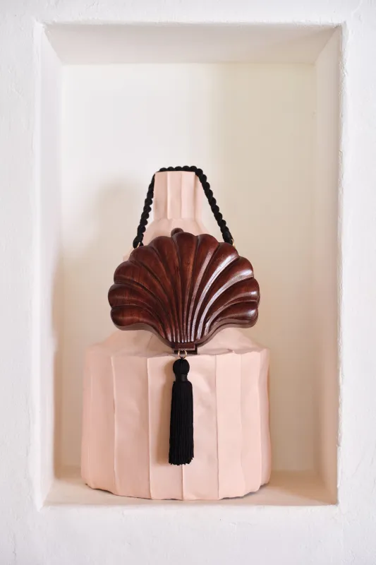 Carved Concha Clutch In Mahogany Brown made by Simon Miller