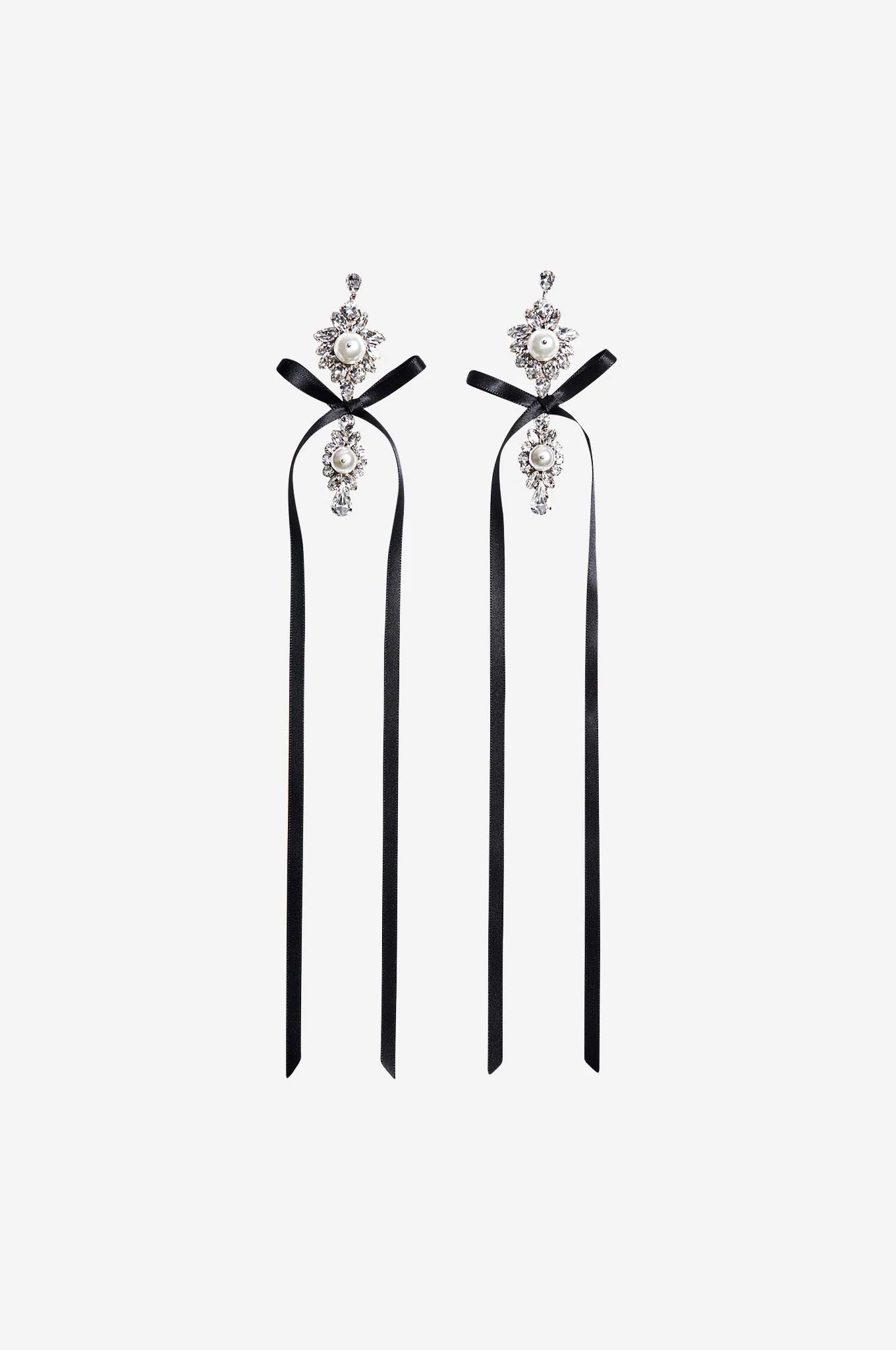 Long Crystal Crest Bow Earrings sold by Simone Rocha