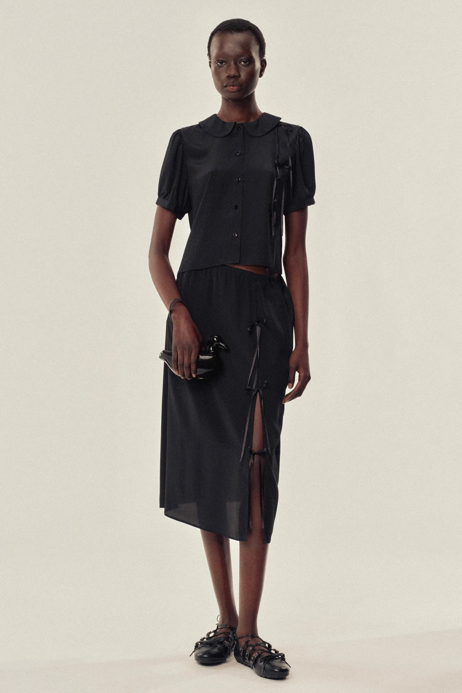 Bow Slit Column Skirt sold by Simone Rocha