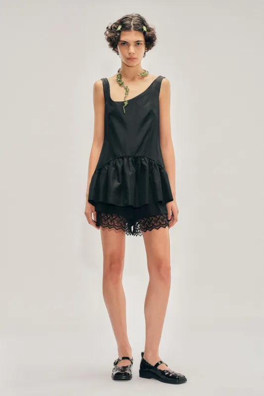 Tilted Neck Peplum Top made by Simone Rocha