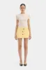 Sandrine Button Mini Skirt sold by SIR the label