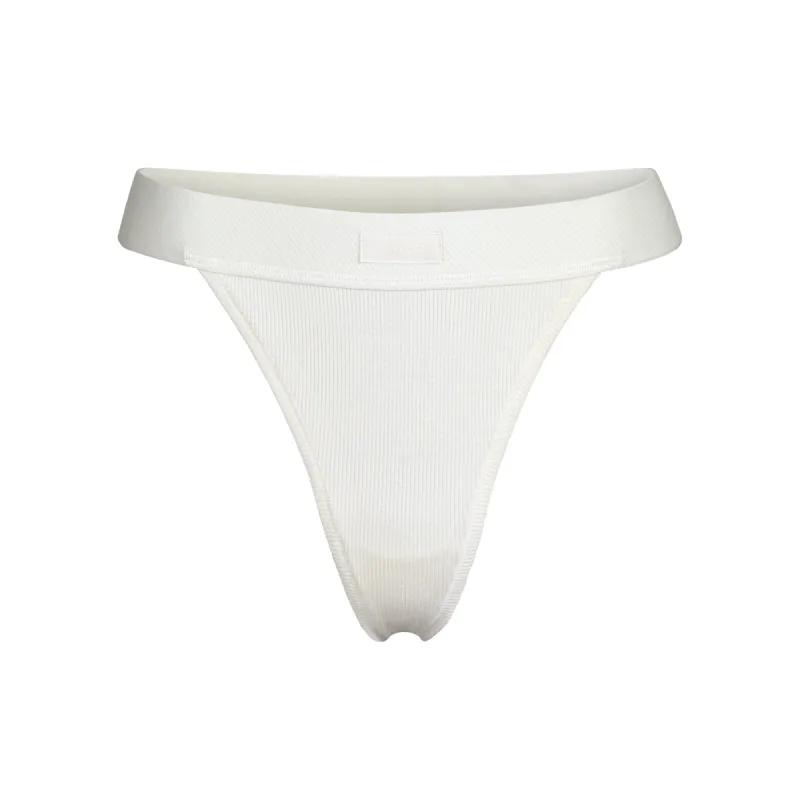 COTTON RIB THONG | BONE sold by SKIMS